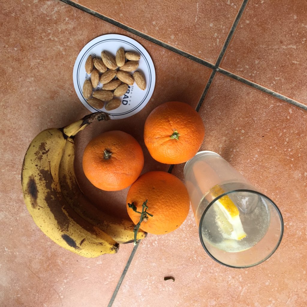 Picknick with oranges, bananas and lime soda